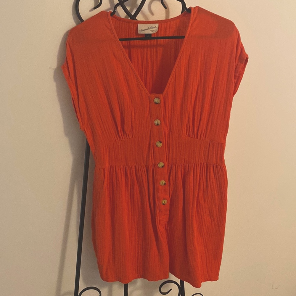 Red romper with buttons and pockets